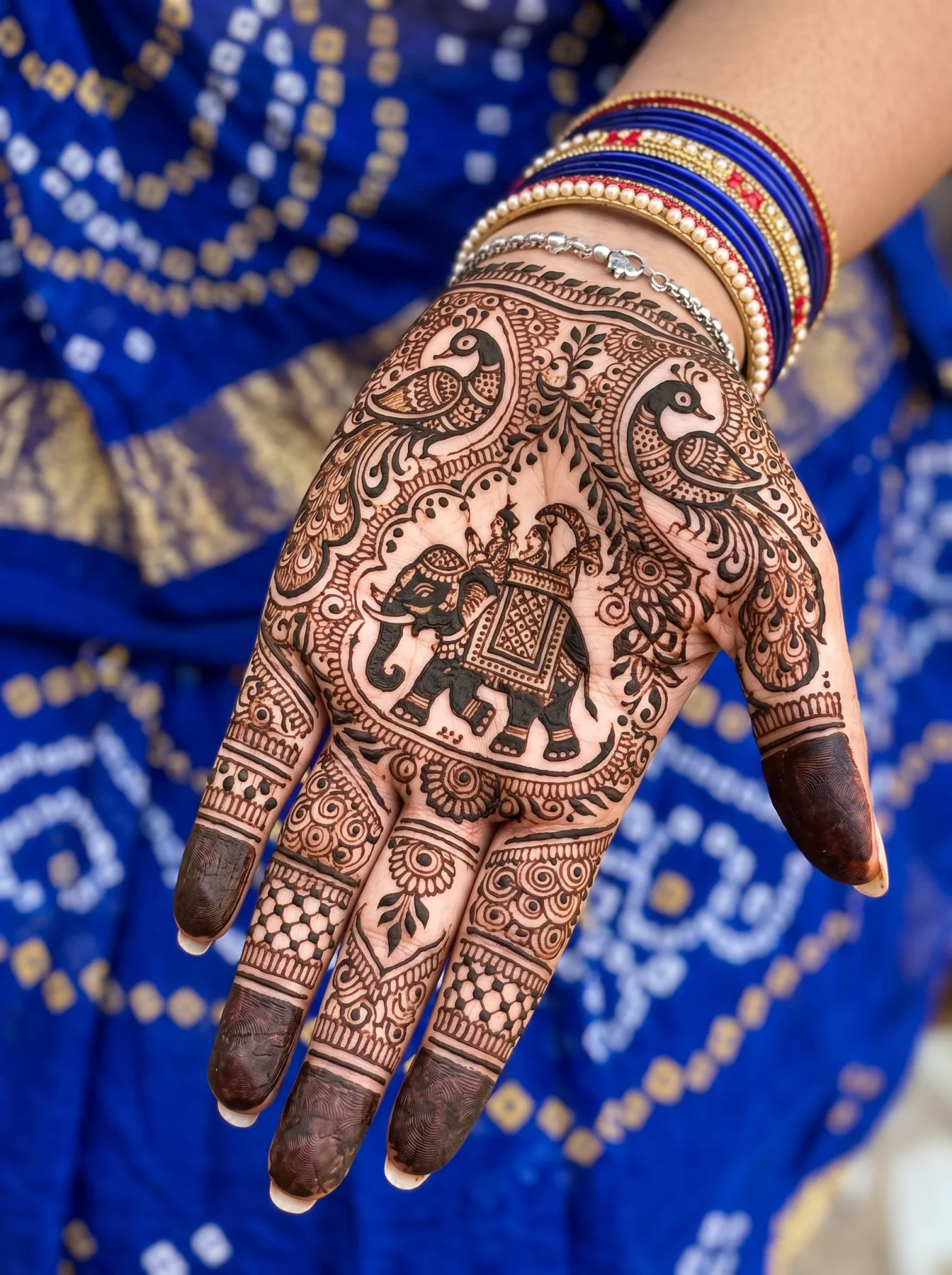 Dark traditional Rajasthani mehndi pattern covering the palm